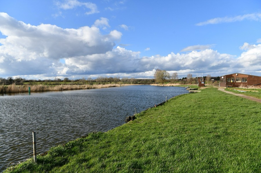 The grassy bank of the River Waveney near Beccles under a big sky
